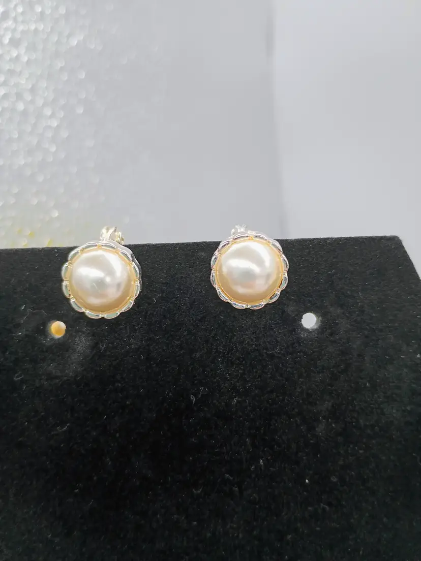 Tjg faux pearl on silver tone clip on earrings.