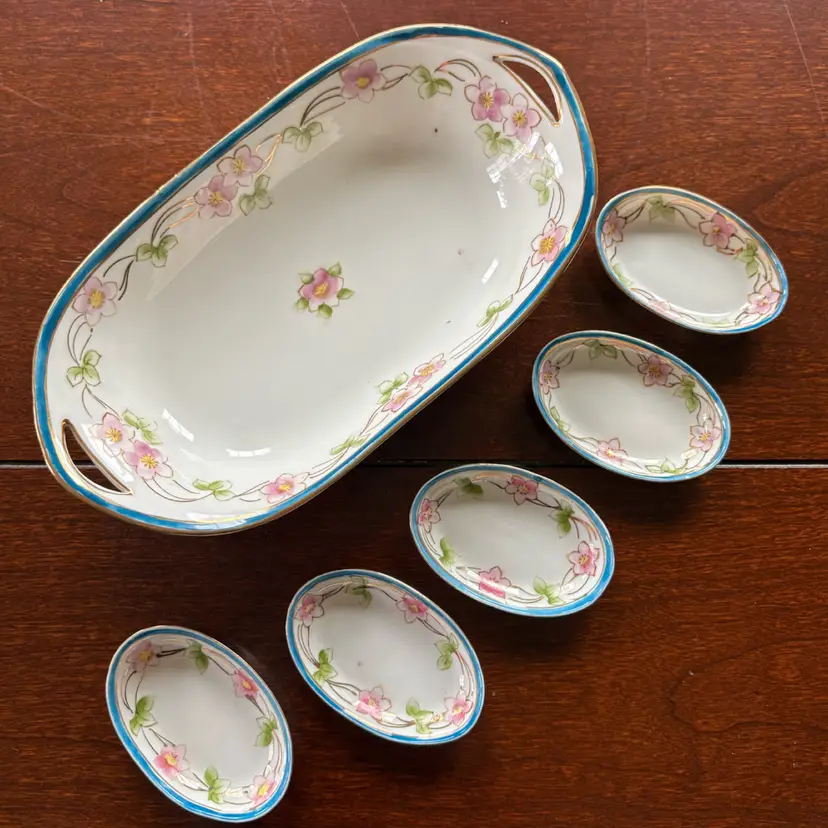 6 Piece ANTIQUE Handpainted Nippon Celery Dish And Salt Cellars. Circa 1891-1921. 7”x3.75” Dish and 2.3”x1.5” Salt Cellars.