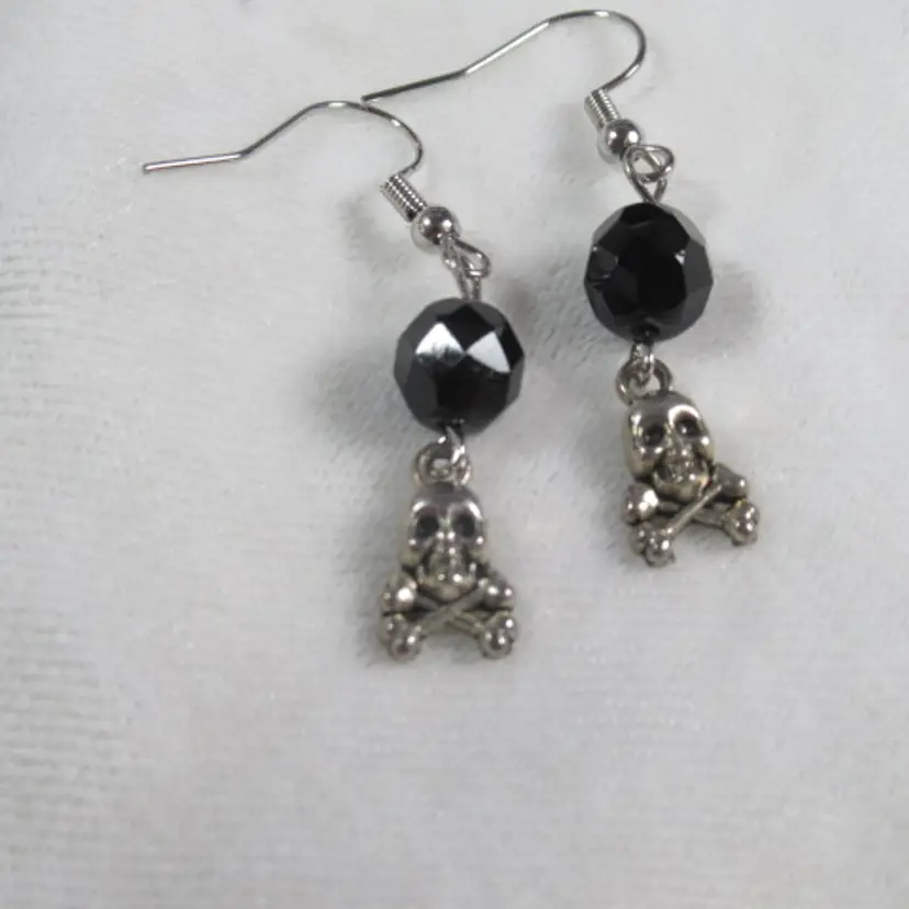 Halloween skull and crossbones ,silvertone charm ,and black glass bead, handmade