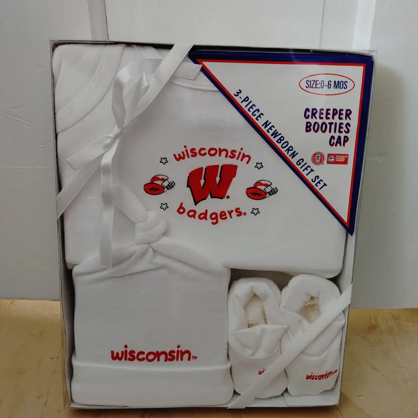 Kids- Brand: HAG. Size 0-6 months. 3 piece set- creeper, booties, cap. New in box. Wisconsin Badger sport set. Material- 100% cotton. No callouts.
