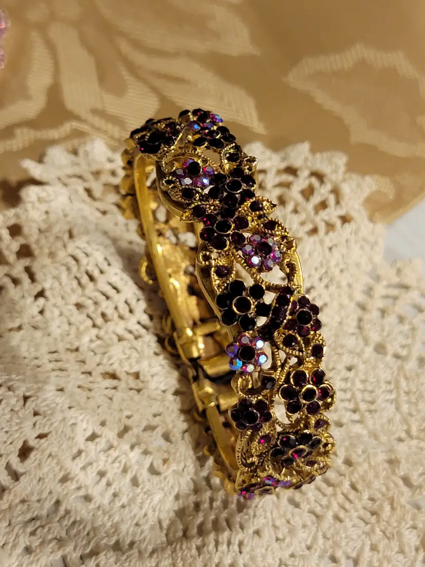Beautiful red and pink rhinestones set in goldtone clamp bracelet