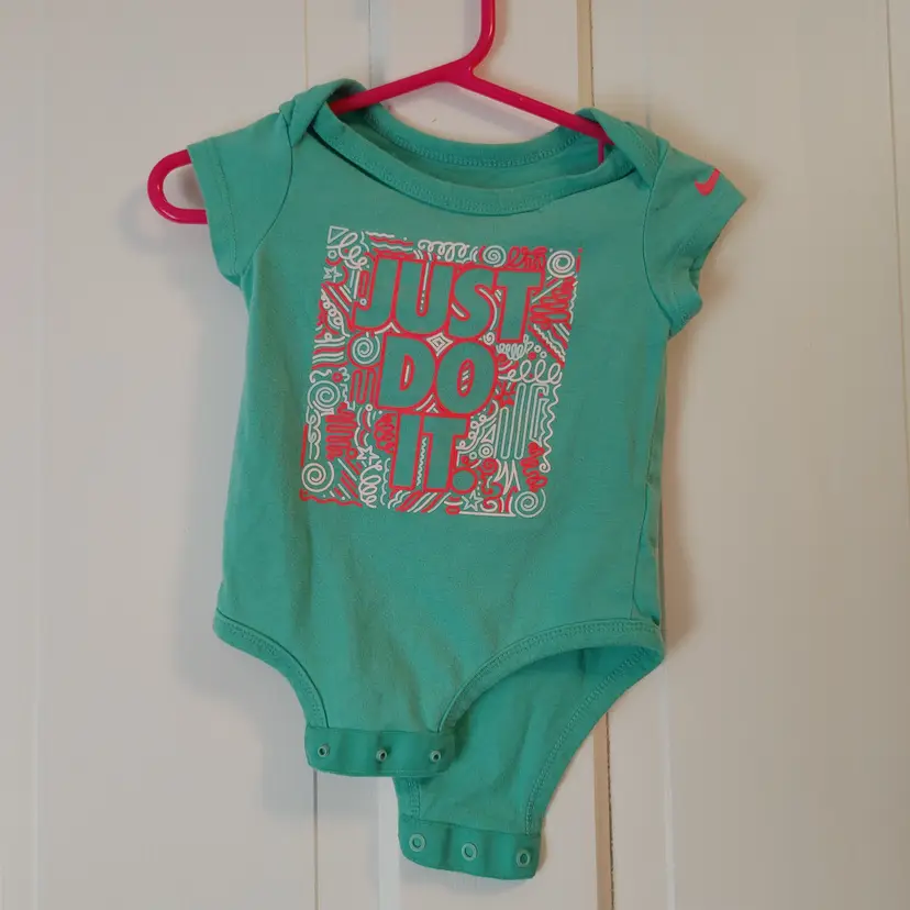Kids- Brand: Nike. Size 3-6 months. Just Do It mint onesie. Material- 60% cotton, 40% polyester. No callouts.