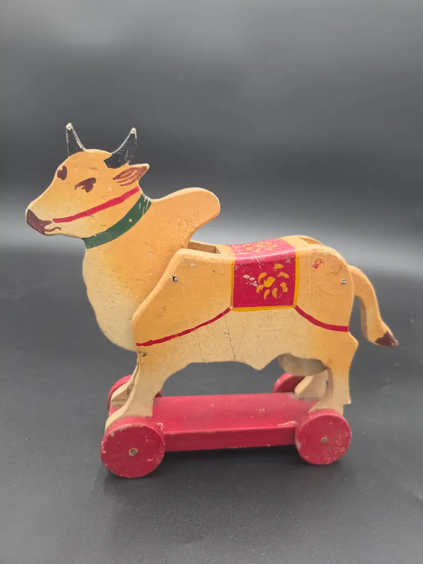 Folk art wooden cow