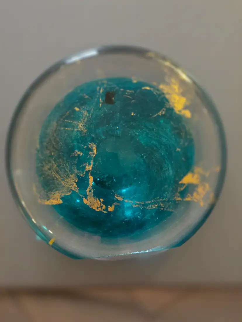 Flat Hand-blown Art Glass Paperweight featuring an Interior Turquoise Core Surrounded by Suspended Gold Leaf Trails