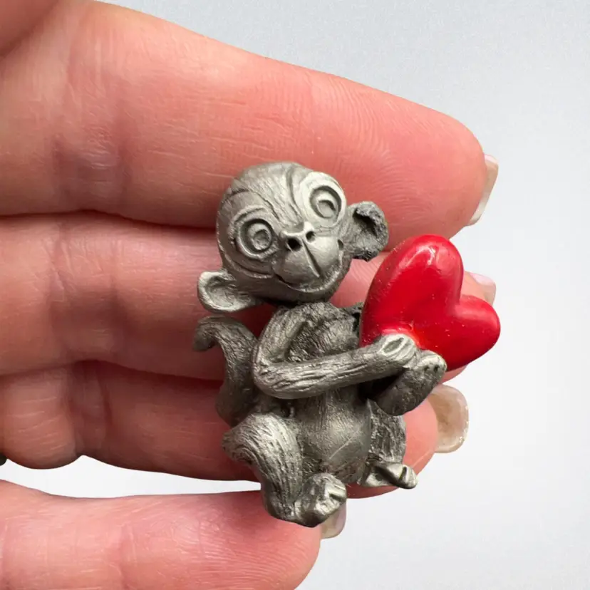 1” Pewter Monkey Holding An Enameled Red Heart Stamp On Bottom