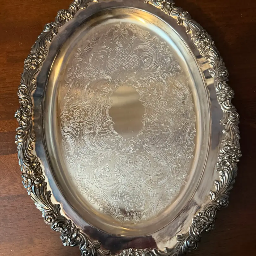 17x12” Sheffield Silver Company This is a vintage silver-plated oval serving tray with an ornate chased border.