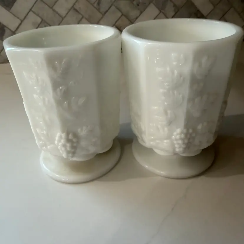 Pair  of vintage Westmoreland milk glass footed cups in the Paneled Grape pattern.