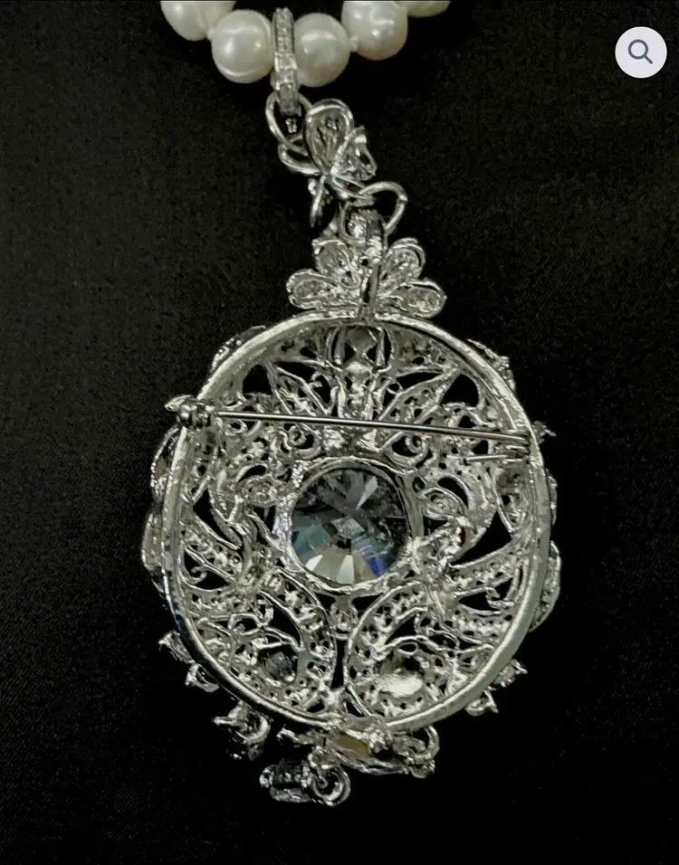 #15NNME - Reconstructed freshwater pearl necklace featuring a detachable ornate rhinestone pendant brooch with Victorian revival styling.