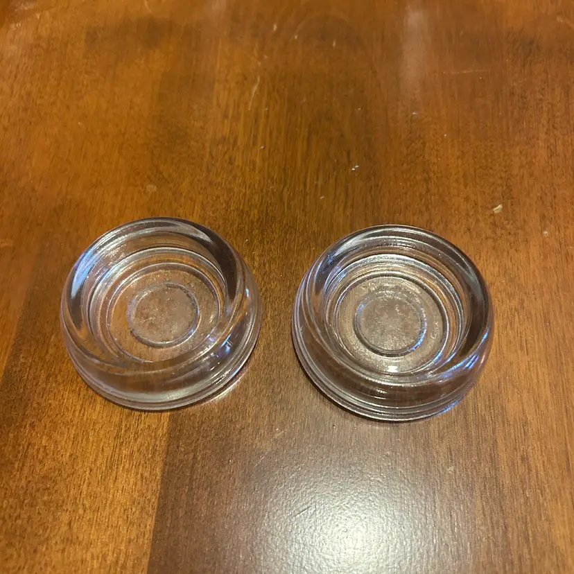 Two Clear Glass Paperweight Holders