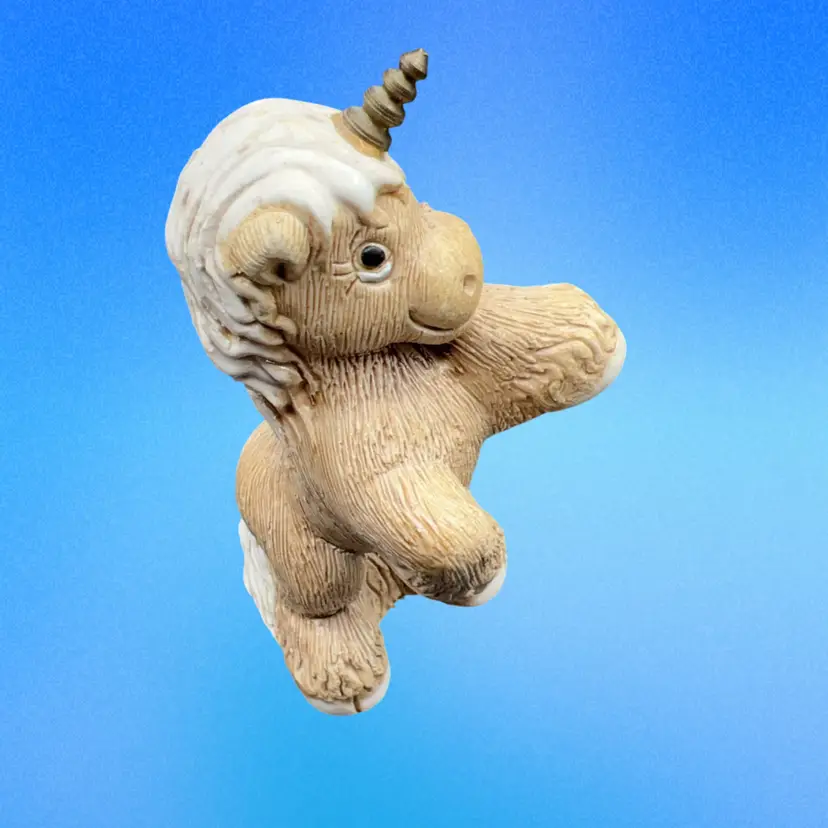 A Magical vintage Artesania Rinconada rearing baby unicorn figurine, handcrafted in Uruguay with textured ceramic pottery and a brass horn