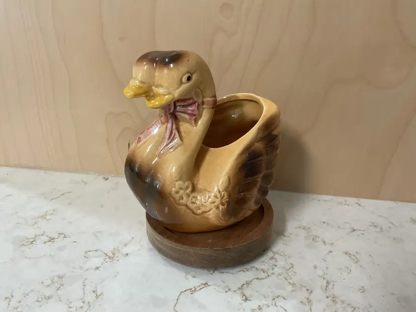 Vintage ceramic two-faced swan with pink ribbon