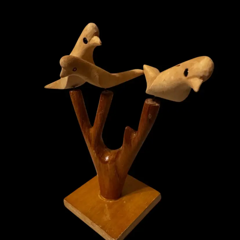 A handcrafted wooden bird sculpture