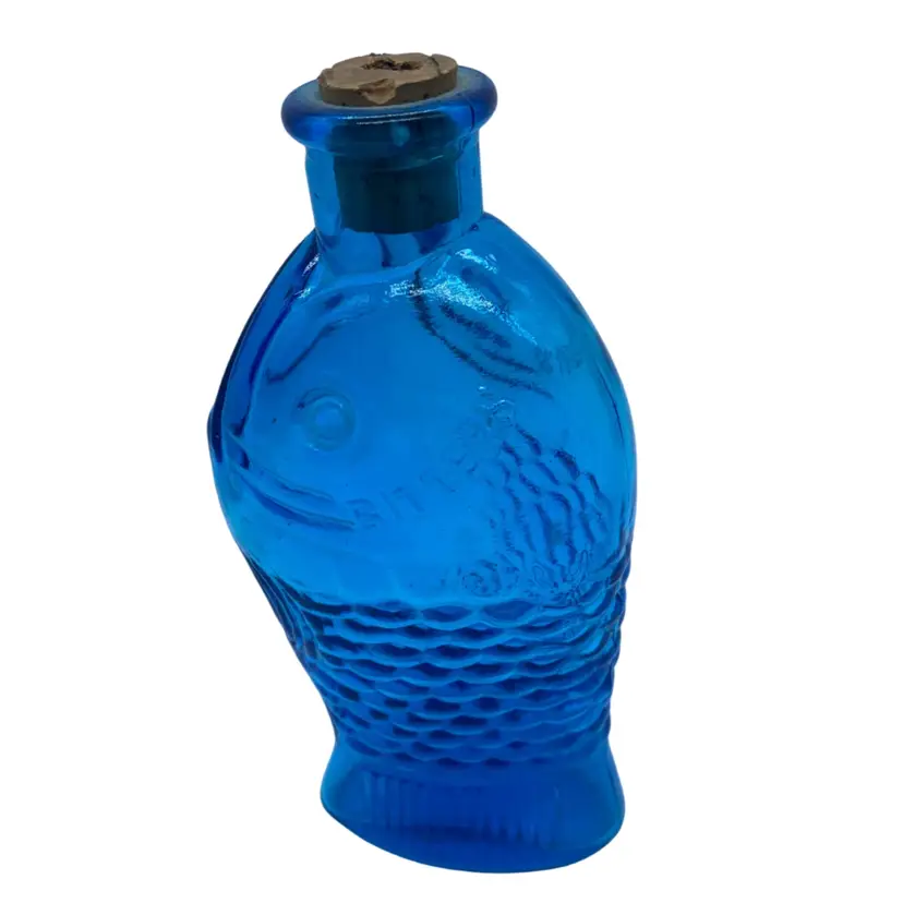 #0209 A vintage blue glass miniature Mr. Fisch's Bitters fish bottle.