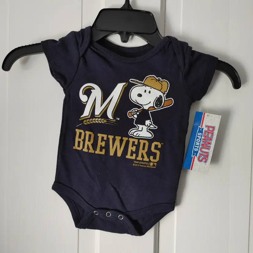 Kids- Brand: Team Athletics- MLB. Size 0-3 months. Peanuts Sports. NWT. Milwaukee Brewers Snoopy baseball Onesie. Material- 100% cotton. No callouts.