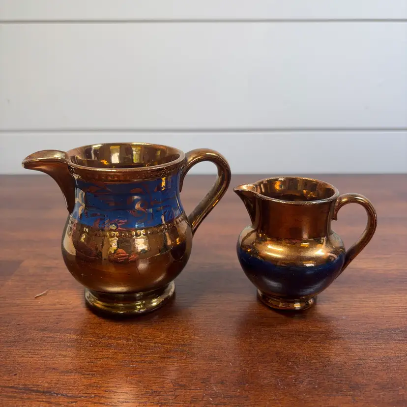 Two Piece, Blue And Gold Ceramic Creamers