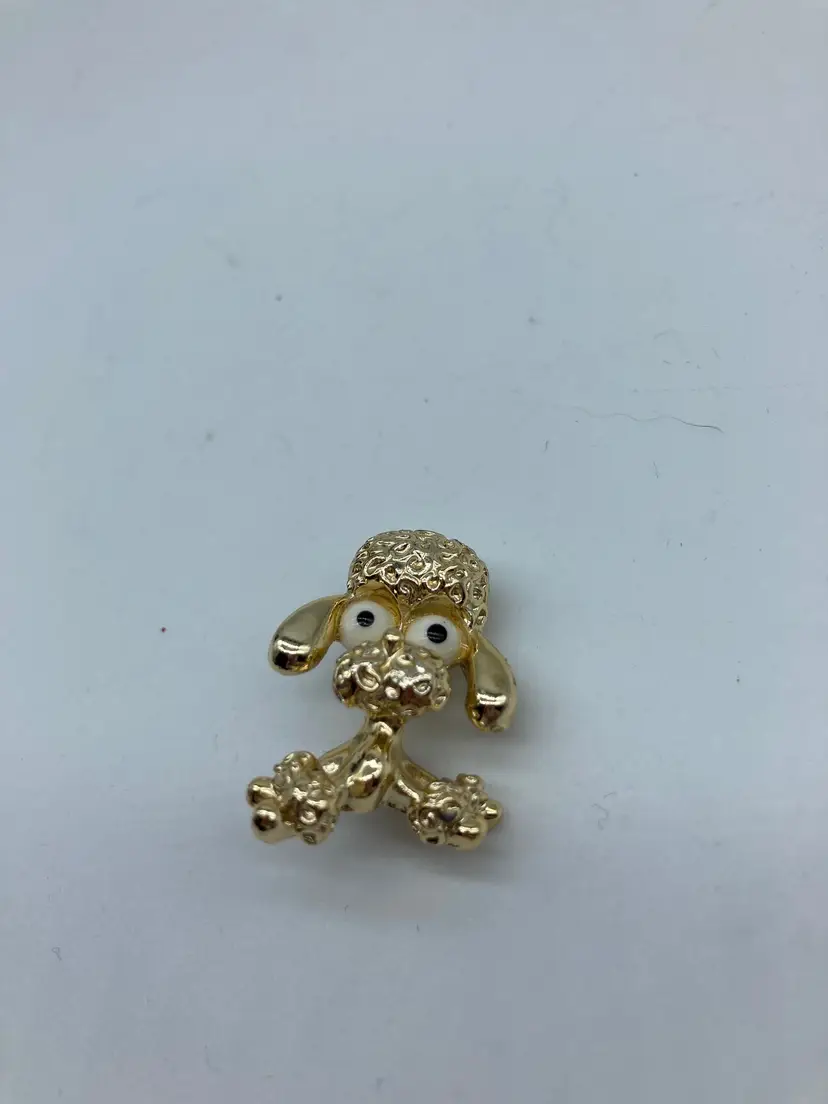 Vintage Tiny Gerry's Gold-Toned Poodle Brooch with Playful Design.