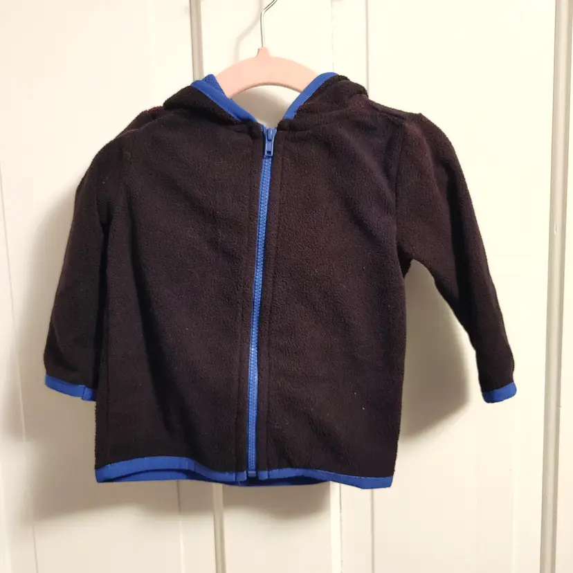 Kids- Brand: Garanimals. Size 12 Months. Black fleece jacket. Material- 100% polyester. No callouts.