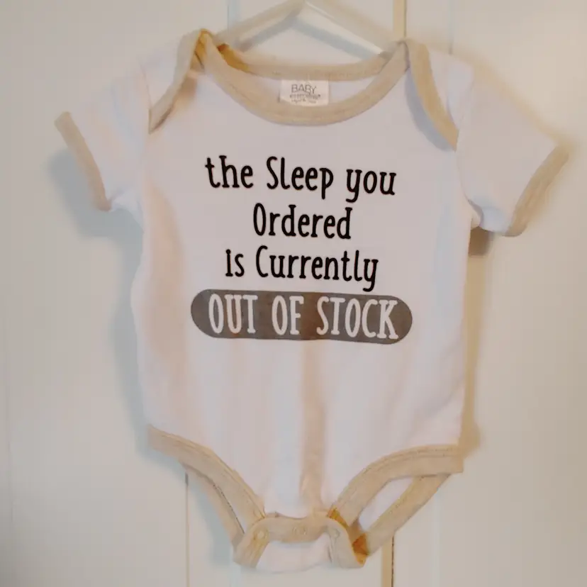 Kids- Brand: Baby Essentials. Size 9 months. Onesie. Material- 60% cotton, 40% polyester. No callouts.