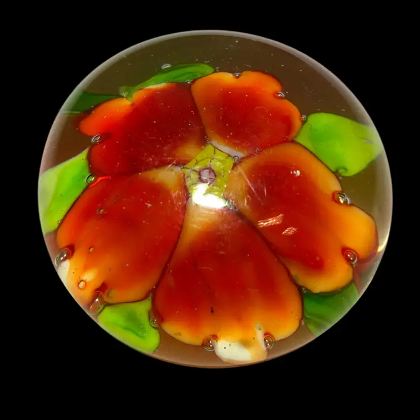 Small Orange Flower Glass Paperweight Encased In Clear Glass