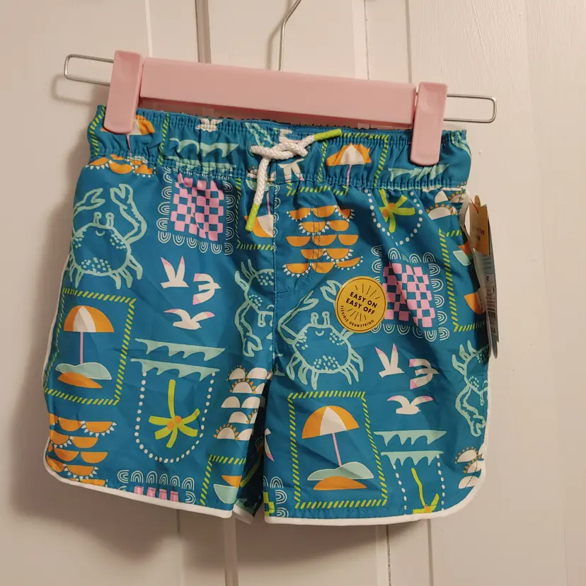 Kids- Brand: Cat & Jack. Size 4T. NWT. Retail $10. Swim shorts. Material- 100% polyester. No callouts.
