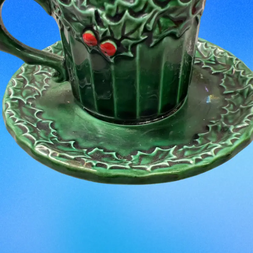 A vintage green ceramic holly berry teacup and saucer set. Lefton? Cup And Saucer Are Attached… Not Aftermarket… Made This Way. Christmas Decor
