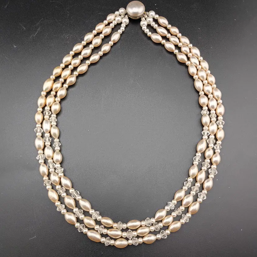 Three strand faux pearl necklace