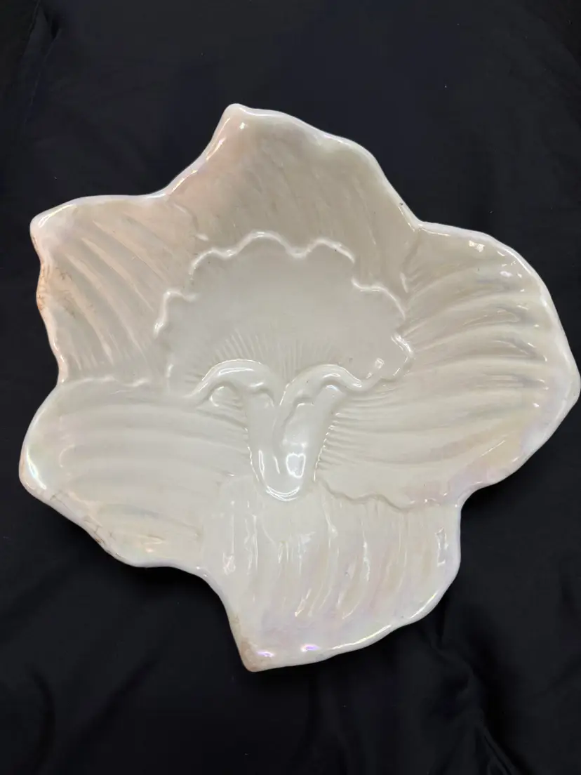 vintage white ceramic dish features an embossed leaf