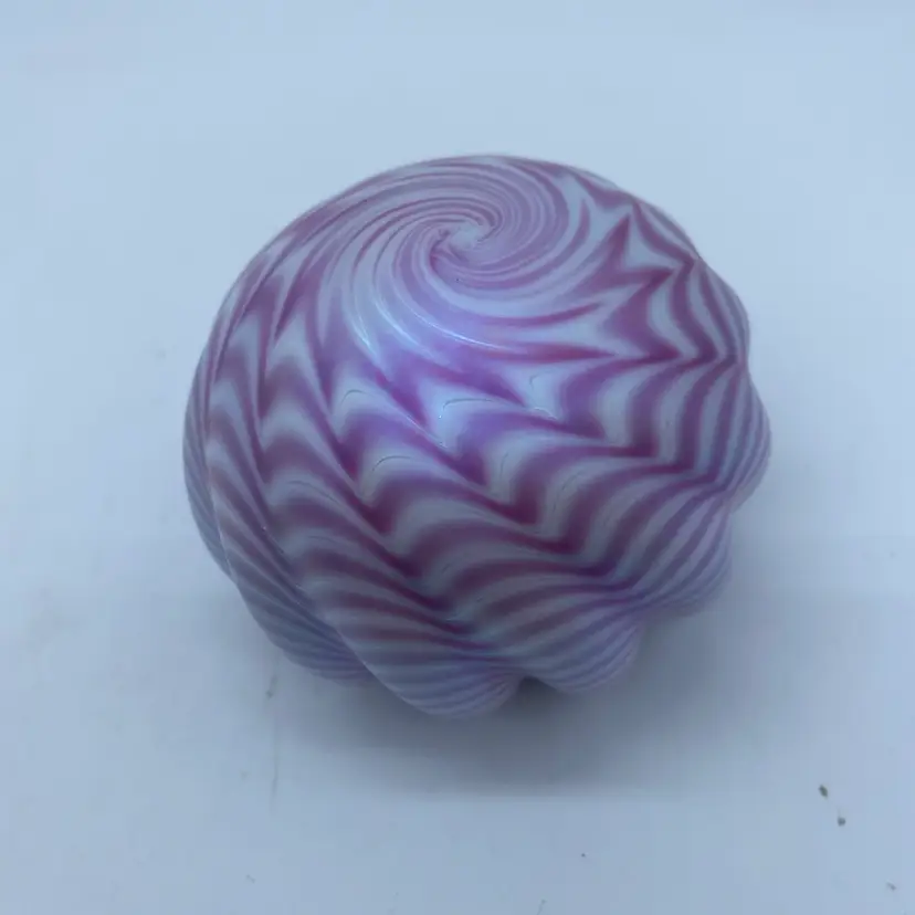 #0050 A signed OBG pink to purple iridescent swirled glass paperweight.