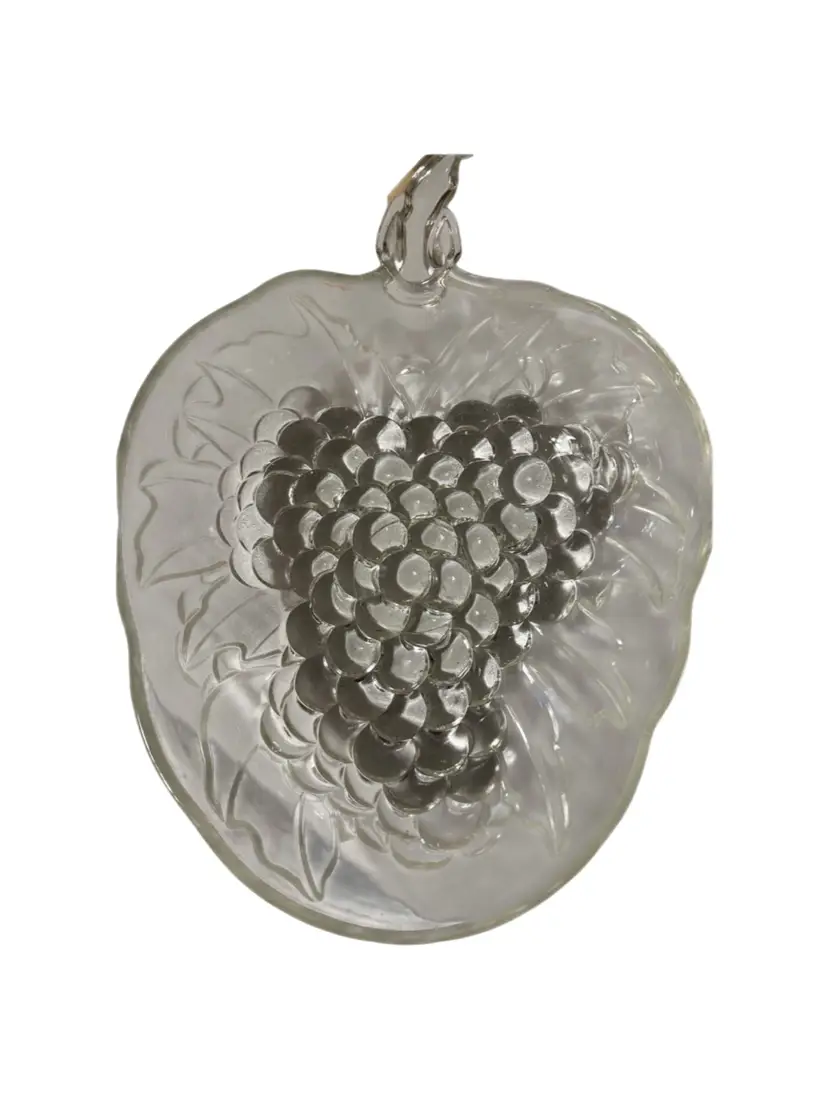 This vintage Indiana Glass fruit bowl features a raised grape cluster pattern with a stem handle