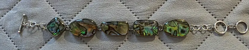 Sterling Silver Link Bracelet Featuring five freeform Abalone Shell Cabochons in Bezel Settings with a Toggle Clasp Closure Made by Lucas Lameth