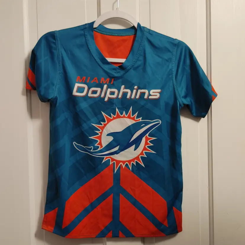 Kids- Brand: NFL Flag Football. Size Youth Medium. Miami Dolphins flag football shirt. Material- Unknown. No callouts.