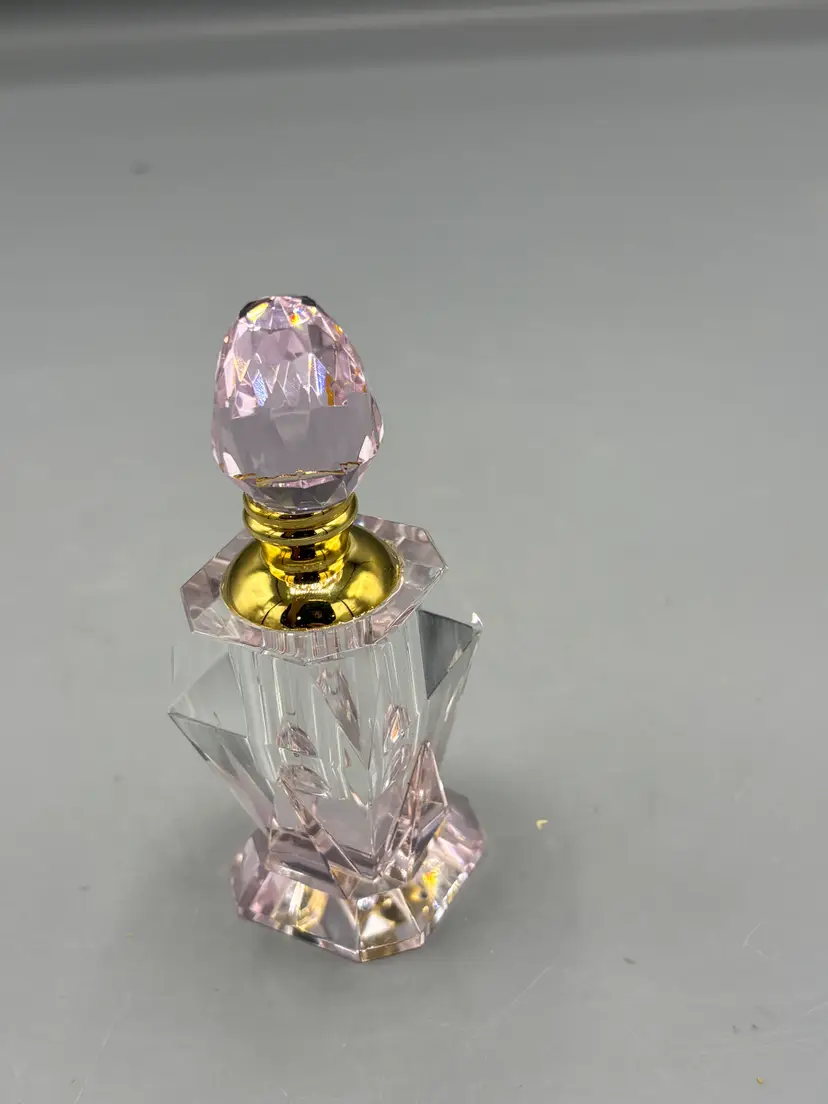 Pale pink crystal perfume bottle
