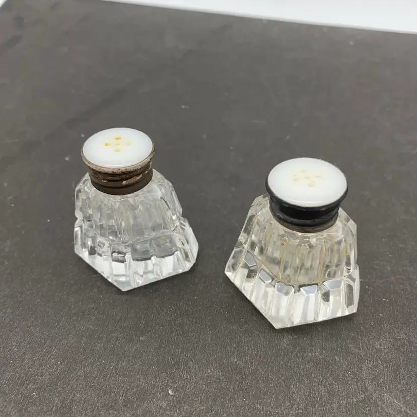 #2015 A pair of antique cut glass salt and pepper shakers with 925 sterling silver caps.