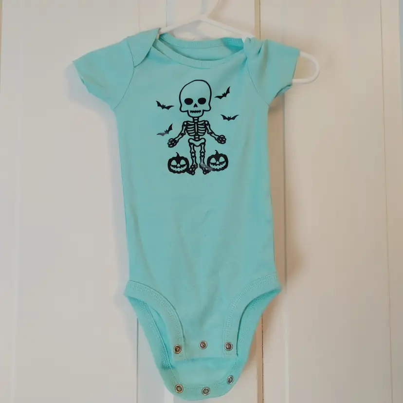 Kids- Brand: Simple Joys by Carters. Size 3-6 months. Skeleton mint onesie. Material- 100% cotton. No callouts.