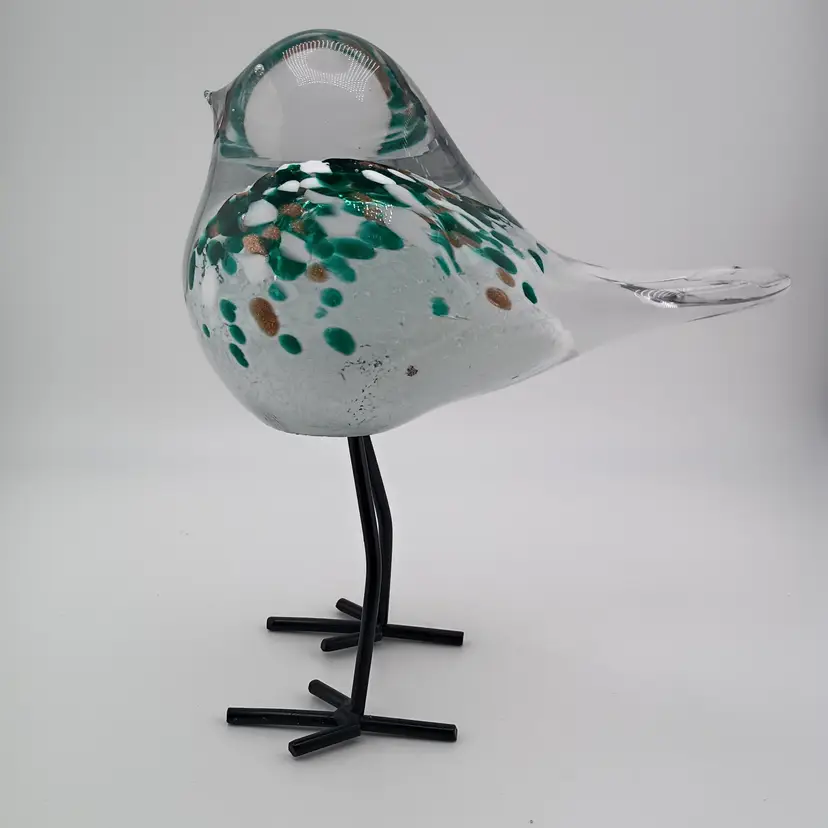 Glass bird on metal legs