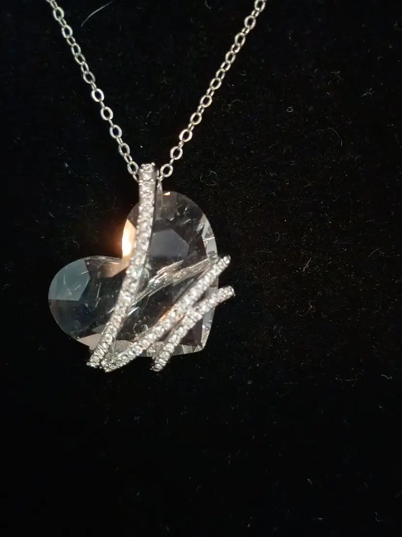 Swarovski Large Clear Crystal Heart Wrapped in Silver Tone Ribbons of Crystals Necklace