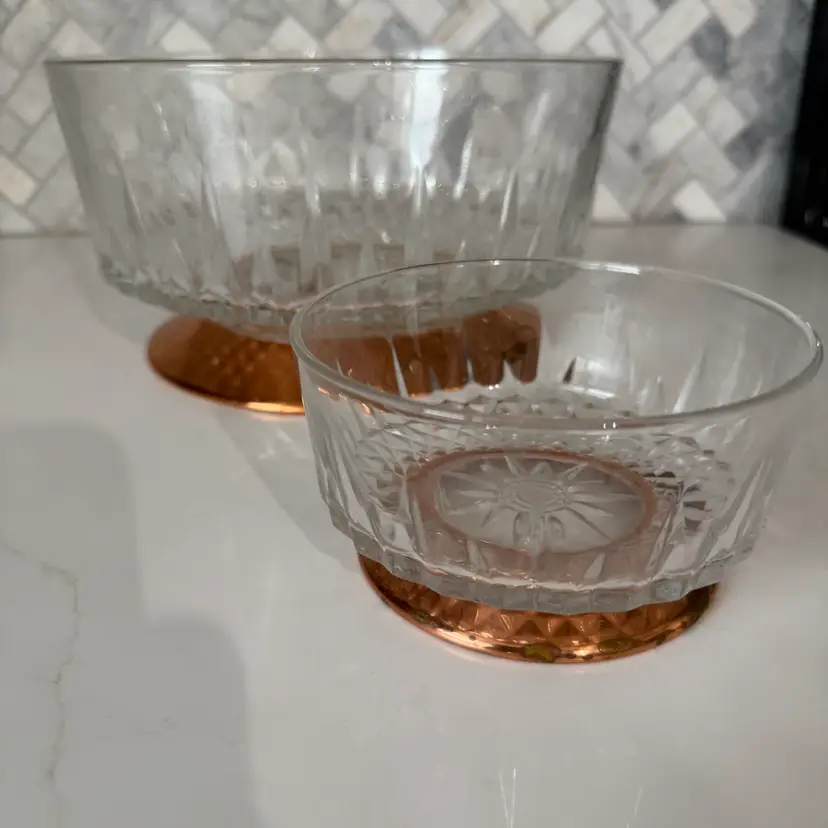 A pair of vintage Arcoroc France 'Diamant' glass bowls with copper bases.
