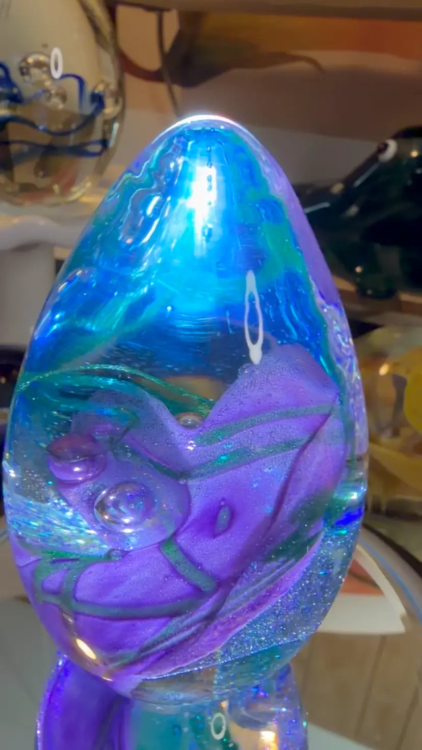 #24…Glass Eye Studio 2002 Art Glass Egg Paperweight – Purple & Blue Swirls with Controlled Bubbles