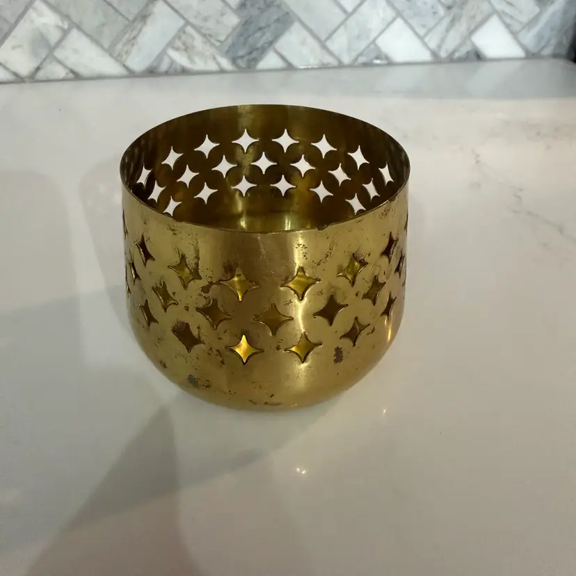 Vintage 1970s pierced brass star pattern tealight candle holder.