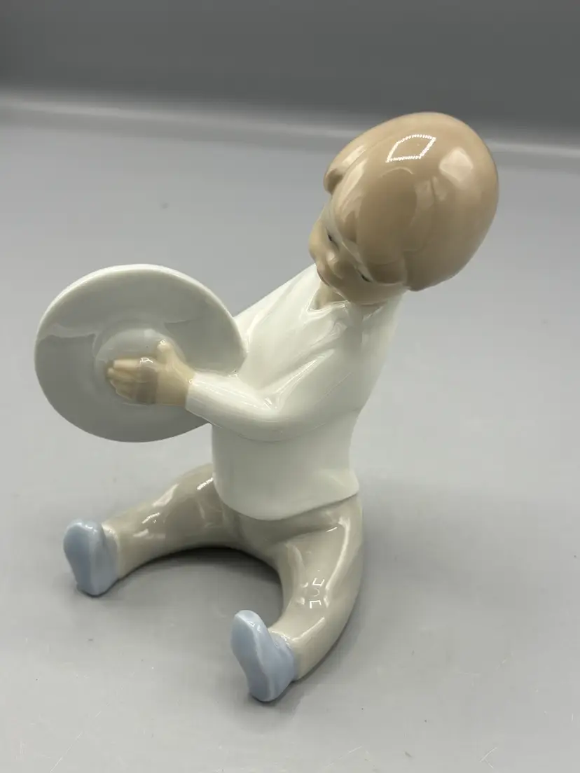 Lladro Boy playing Cymbals