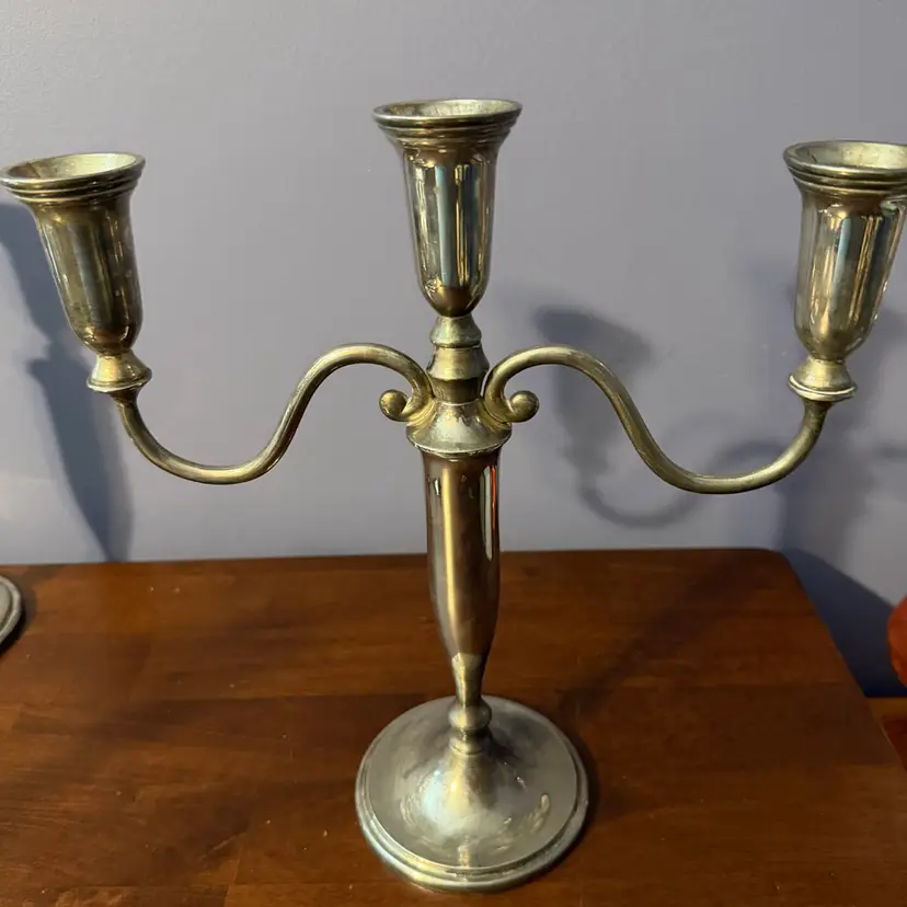 Godinger vintage silver-plated three-light table candelabra.