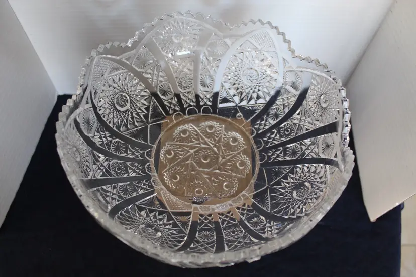 Vintage heavy clear pressed glass footed centerpiece bowl with sawtooth rim and geometric starburst/fan pattern. Probably American-made, circa 1930s–1950s. Manufacturer and pattern not yet identified.