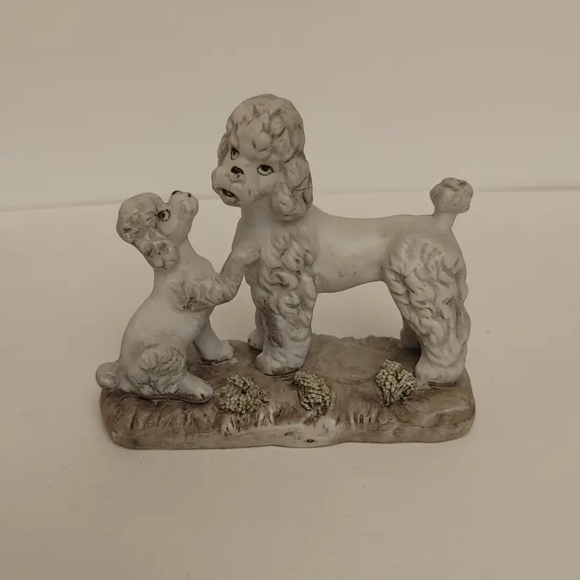 Grey poodle figurine. Made in Korea. 1950-70. 3.5 inches tall. No chips or cracks.