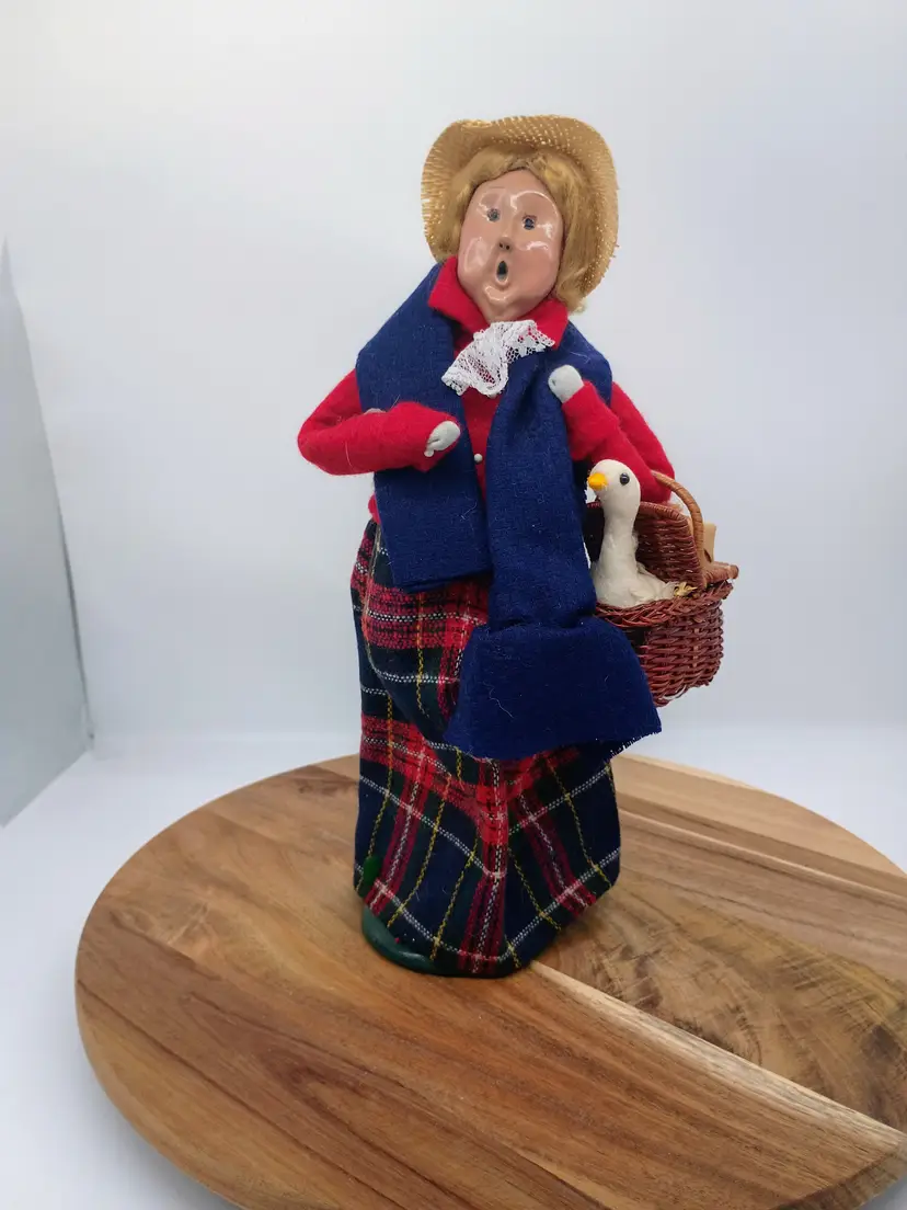 Byers Choice Carolers Woman Shopper with Goose and Packages in a Basket 1995.