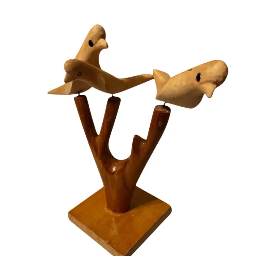 A handcrafted wooden bird sculpture