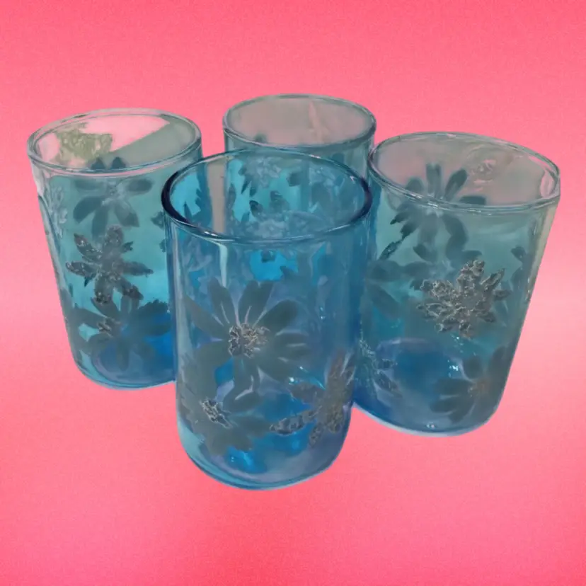 014 Vintage Libbey blue tumblers with a raised white floral design.