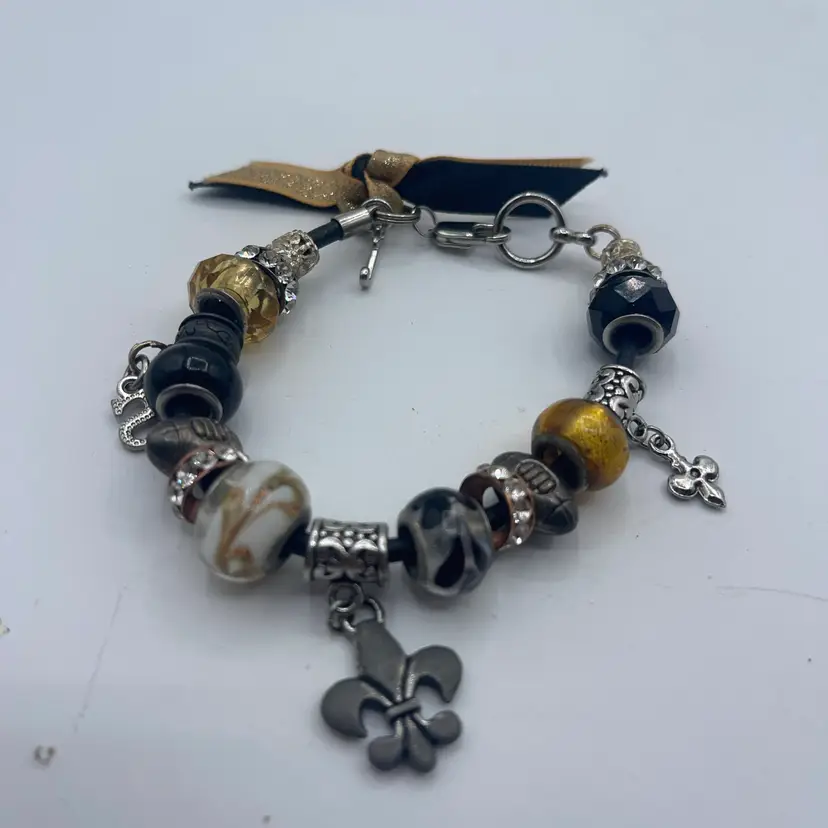 7 Inch Bracelet With Fleur De Lis Footballs In Different Glass, Charms, Gold, And Black