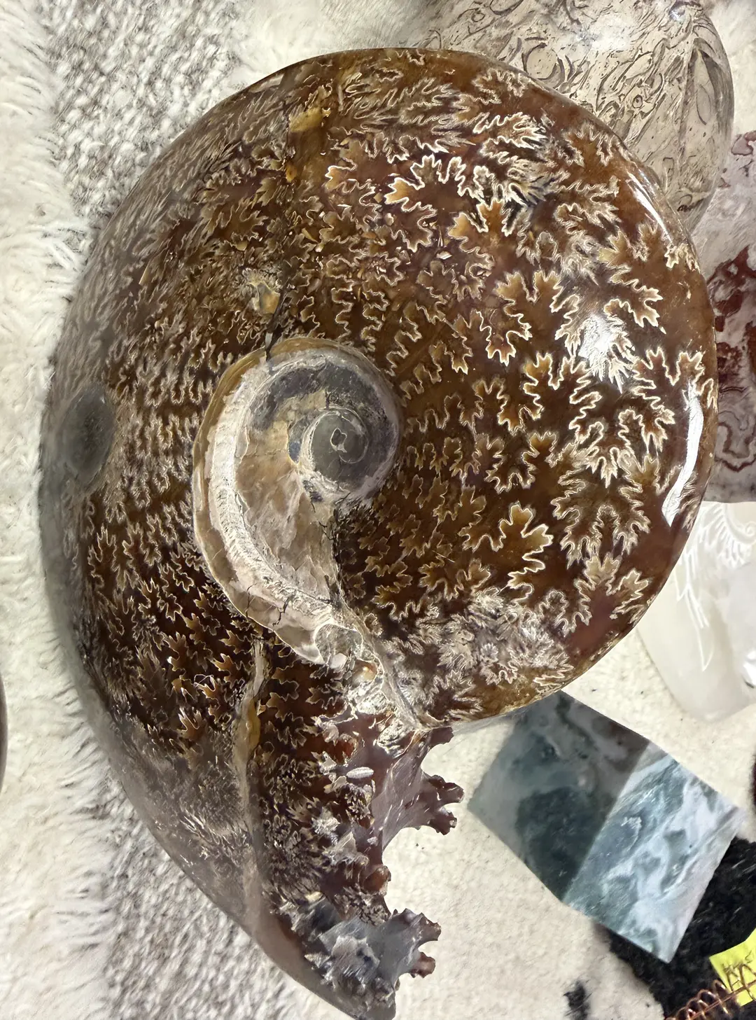 Copper coil jewelry on amethyst geode display