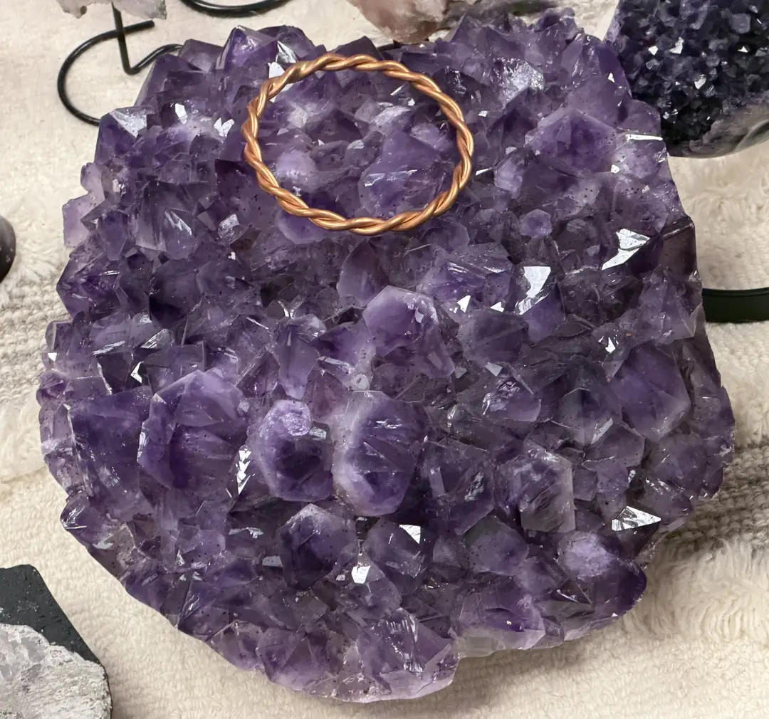 Amethyst geode with copper coil accents