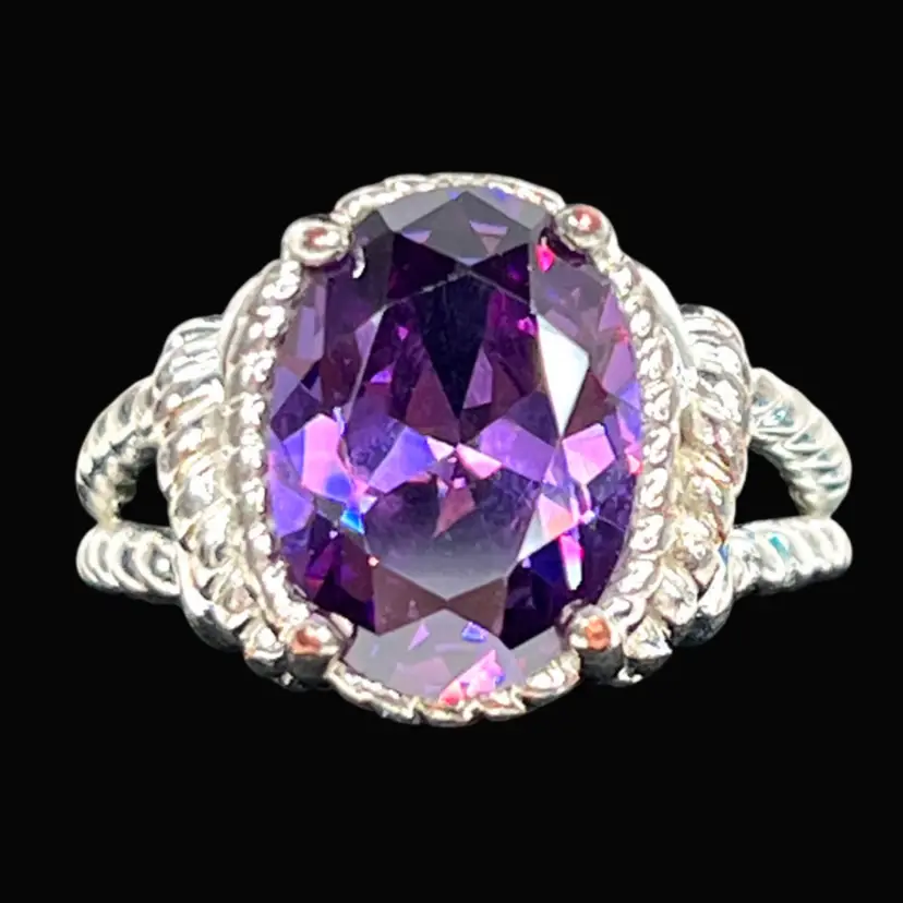 Avon Purple Round Faceted Stone Costume Ring. Stamped “NVC” and “9” for Size 9. Silver-tone Metal.